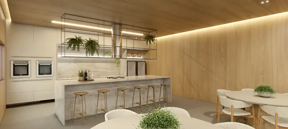 Segundo ambiente do espaço gourmet, com bancada e cozinha equipada