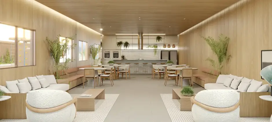 Espaço gourmet com vista para o mar e ambientação em madeira clara