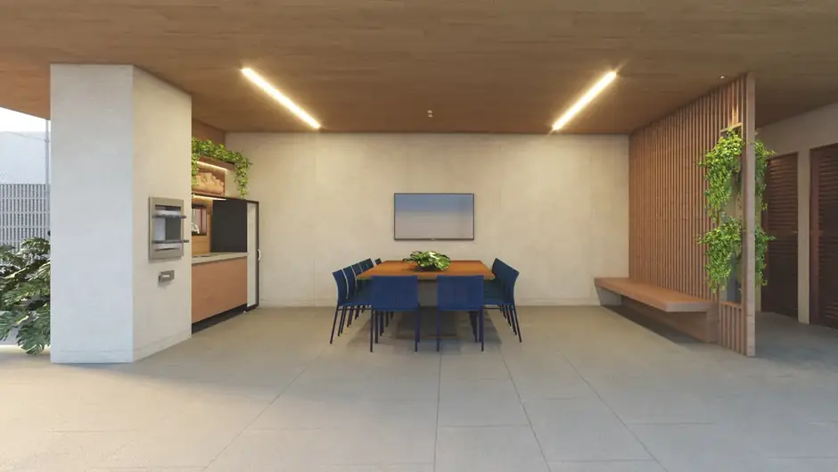 Espaço grill com churrasqueira, mesa para oito lugares e jardim vertical