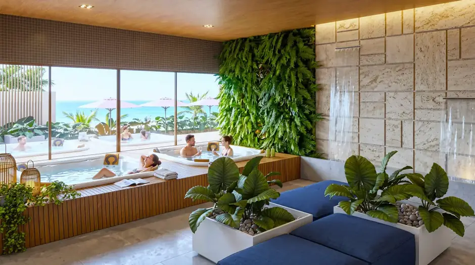 Spa com hidromassagem e jardim vertical, com vista para o mar